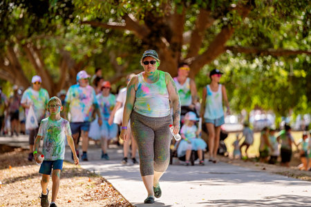 Mackay, Queensland, Australia - November 24th 2019: Unidentified woman and young boy walking in 5 K...