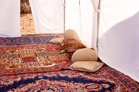 An outdoor tent with rugs and cushions for lying about and restingの写真素材