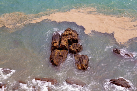 Synchronized spawning of corals - coral spawning looking like brown sludge as eggs and sperm are...