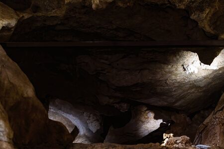 A cavern inside Australia's bat ecotourism Capricorn Caves, where the light is extremely low and photography difficultの写真素材