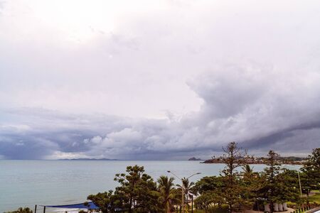 Yeppoon, Queensland, Australia - December 2019: Storm clouds gather out to sea above the beach, threatening rain to comeのeditorial素材