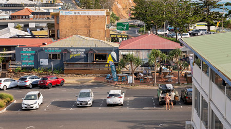Yeppoon, Queensland, Australia - December 2019: A hotel beer garden and cafe filled with young...