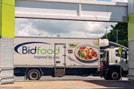 Walkerston, Queensland, Australia - February 2020: A truck delivering produce to Woolworths supermarket chain and the surrounding shopsのeditorial素材