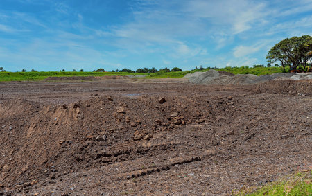Mounds of dirt moved to create a stockpile within a housing development subdivision