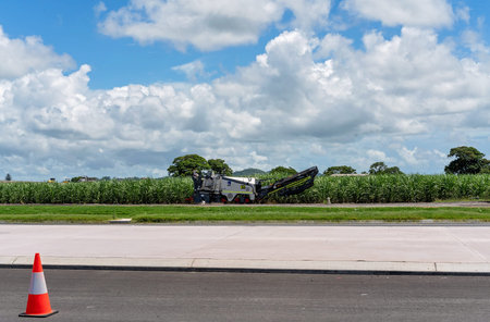 Mackay, Queensland, Australia - February 2020: Machine to lay bitumen on new road construction of...