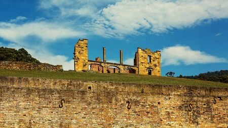 The former penal colony of Port Arthur on the Tasman Peninsular where convicts were transported and housed in Australia, now a tourist attraction. Cinematic colour toning.の写真素材