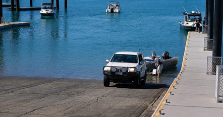 Mackay, Queensland, Australia - June 2020: Man loading his tinny at public recreational boat ramp at...