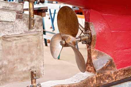A boat rudder and propeller in closeup at a maritime museum