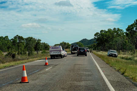 Townsville, Queensland, Australia - June 2020: Police attend an accident on the bruce Highway and direct traffic flowのeditorial素材