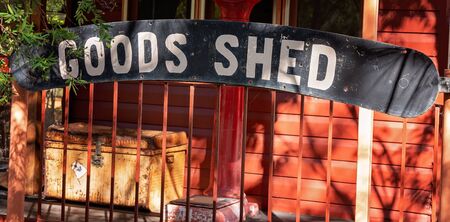 Goods shed signage attached to old train carriage at Australian outback tourist resortの写真素材