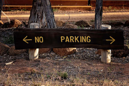 No parking sign with directional hours in an Australian outback bush resortの写真素材