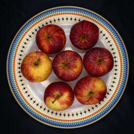 A plate full of red juicy delicious apples promoting healthy eating