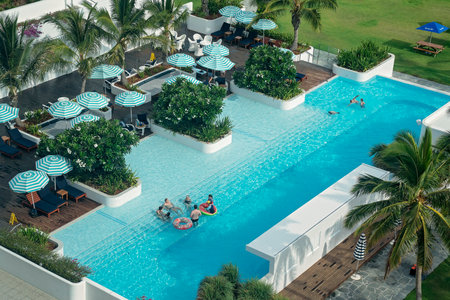 Townsville, Queensland, Australia - December 2020: Looking down on guests swimming in pool at casino resort hotelのeditorial素材