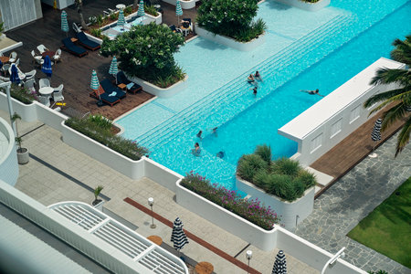 Townsville, Queensland, Australia - December 2020: Looking down on guests swimming in pool at casino resort hotelのeditorial素材