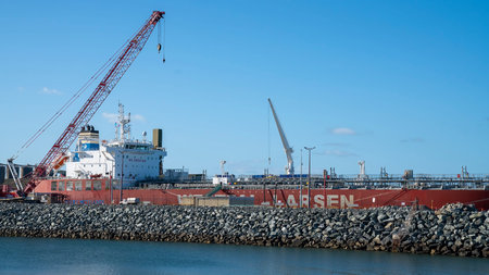 Mackay, Queensland, Australia - January 2021: Large container ship moored at the port wharf ready to...