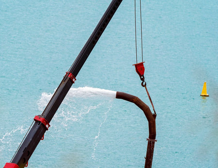 Close up of an industrial hose pumping sea water