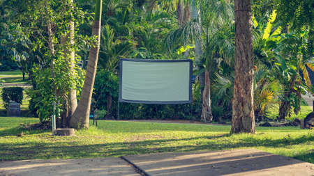 An outdoor movie screen in a tropical tourist caravan park for guest viewingの写真素材