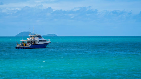 Airlie Beach, Queensland, Australia - February 2021: A research boat loaded with equipment and...