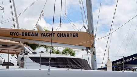 Airlie Beach, Queensland, Australia - February 2021: QYC Dream Yacht Charter moored in the marina -...