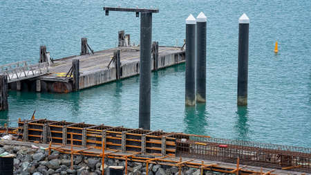 Airlie Beach, Queensland, Australia - February 2021: Industrial site with equipment working on harbor expansionのeditorial素材