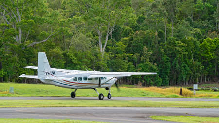 Airlie Beach, Queensland, Australia - February 2021: A light aircraft filled with skydivers taxiing along the runway prior to takeoffのeditorial素材