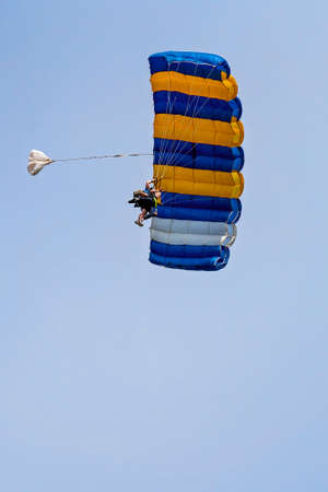 Airlie Beach, Queensland, Australia - February 2021: Tandem skydivers with parachute open coming into landのeditorial素材