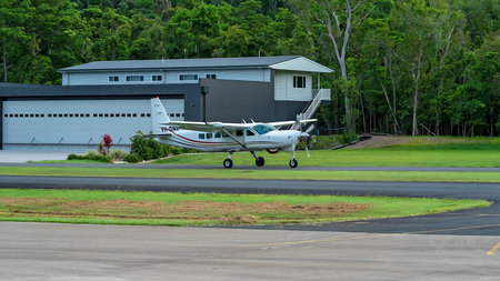Airlie Beach, Queensland, Australia - February 2021: A light aircraft filled with skydivers taxiing...