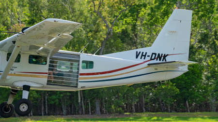 Airlie Beach, Queensland, Australia - February 2021: A light aircraft filled with skydivers takes off for their flightのeditorial素材
