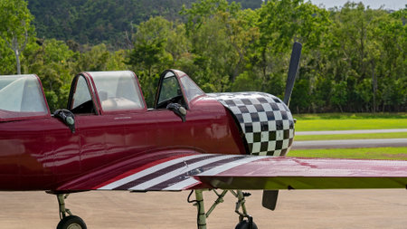 Airlie Beach, Queensland, Australia - February 2021: A light aircraft parked beside the airport runwayのeditorial素材