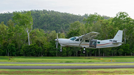 Airlie Beach, Queensland, Australia - February 2021: A light aircraft filled with skydivers takes off for their flightのeditorial素材