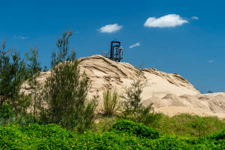 Sand pump tower stockpiling sand pumped from a riverの写真素材