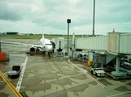 Brisbane Airport, Queensland, Australia - March 2021: An air plane parked at the airport to load and...