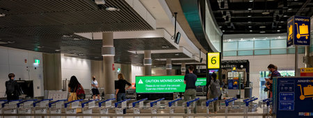 Brisbane Airport, Queensland, Australia - March 2021: Trolleys that can be hired to transport...