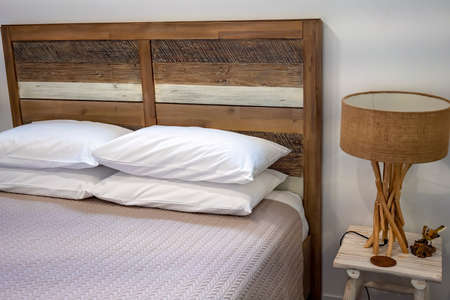Bedroom suite with side table and lamp, rustic timber lookの写真素材