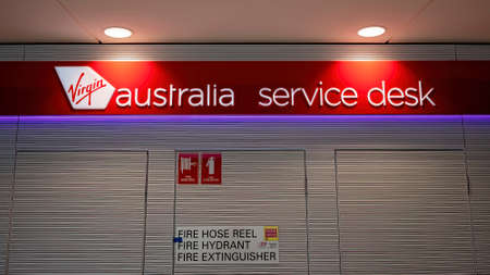 Brisbane, Queensland, Australia - March 2021: Virgin Australia service desk signageのeditorial素材