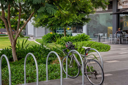 Brisbane, Queensland, Australia - March 2021: A bicycle in rack outside a garden coffee shopのeditorial素材