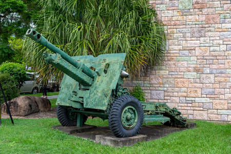Brisbane, Queensland, Australia - March 2021: Old war artillery equipment on display in a city gardenのeditorial素材