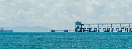 Mackay, Queensland, Australia - March 2021: Dalrymple Bay Coal export loading terminal with a container ship waiting to be filledのeditorial素材