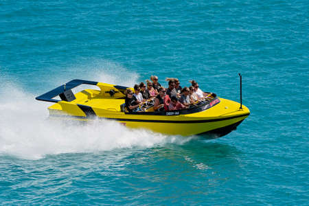 Airlie Beach, Queensland, Australia - April 2021: Passengers having fun in a jet boat adrenaline ride on the ocean at Whitsundaysのeditorial素材