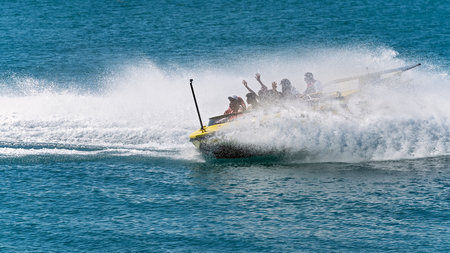 Airlie Beach, Queensland, Australia - April 2021: Tourists having fun in a jet boat adrenaline ride on the ocean at Whitsundaysのeditorial素材