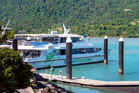 Airlie Beach, Queensland, Australia - April 2021: Tourist cruise boat berthed waiting for passengers at marinaのeditorial素材