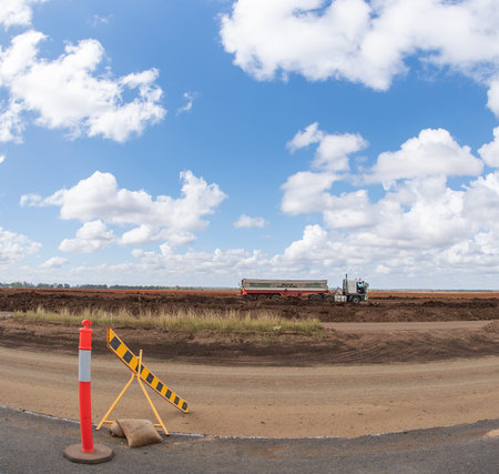 Clermont, Queensland, Australia - May 2021: A four wheel drive white car parked roadside in front of a field of sorghum fish eye lensのeditorial素材