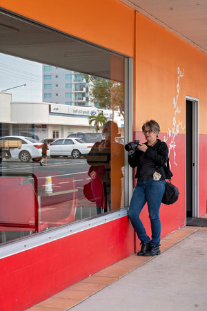 Mackay, Queensland, Australia - June 2021: Female photographer capturing street imagery