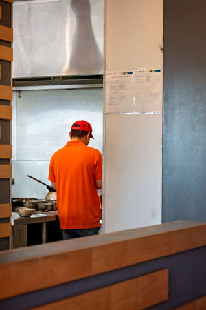Mackay, Queensland, Australia - June 2021: Cook in a sushi kitchen creating foodのeditorial素材