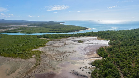 Aerial view over salt pans and bushland out towards the ocean at Cape Palmerston Australia