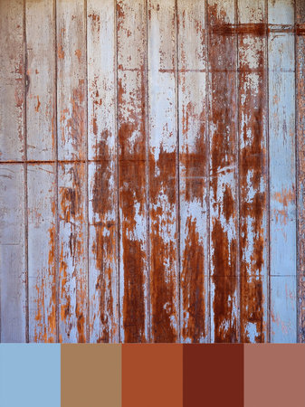 An old timber wall with peeling paint and lots of texture. Ideal background for your projects. Color...