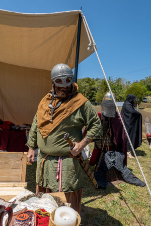 Eungella, Queensland, Australia - October 2021: A man in costume with sword and helmet at a medieval...
