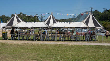 Eungella, Queensland, Australia - October 2021: A viking village re-enactment fair in the country with visitors milling around under tentsのeditorial素材