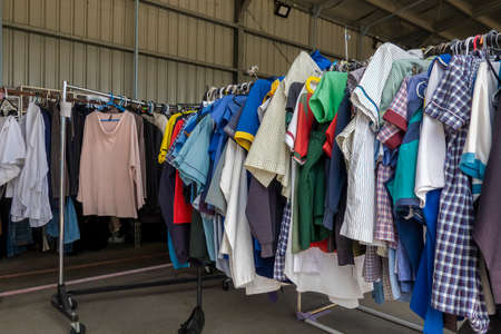 Mackay, Queensland, Australia - October 2021: Clothes on racks for sale at local Tip Shopのeditorial素材