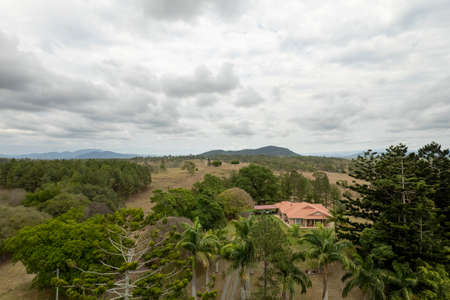 Mackay, Queensland, Australia - October 2021: Drone aerial flying over country homestead nestled amongst treesのeditorial素材